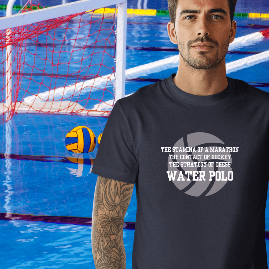 Man wearing a navy t-shirt with water polo text in front of a pool with a water polo ball and net.